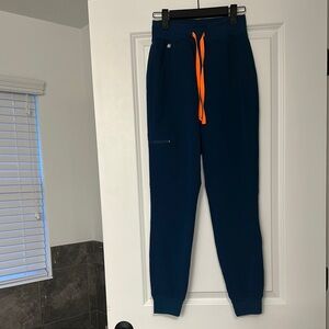Gently used women’s Navy Joggers with Orange Drawstring